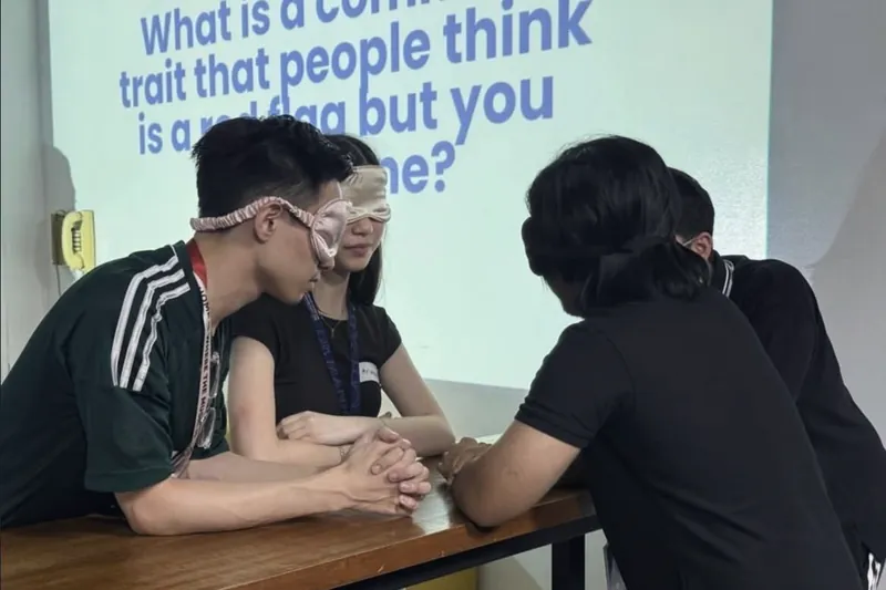 Members laughing during a Venture Vibes icebreaker